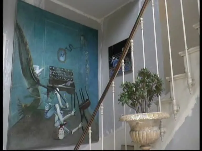 A painting beside the staircase in Pierre and Micheline Carron’s home in Chartres