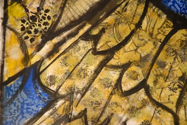 Detail of painted glass, yellows and blues.